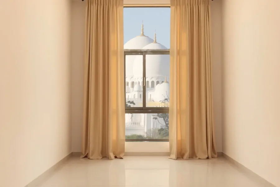 Illustrative view: a room with made-to-measure curtains and the Sheikh Zayed Grand Mosque beyond the window