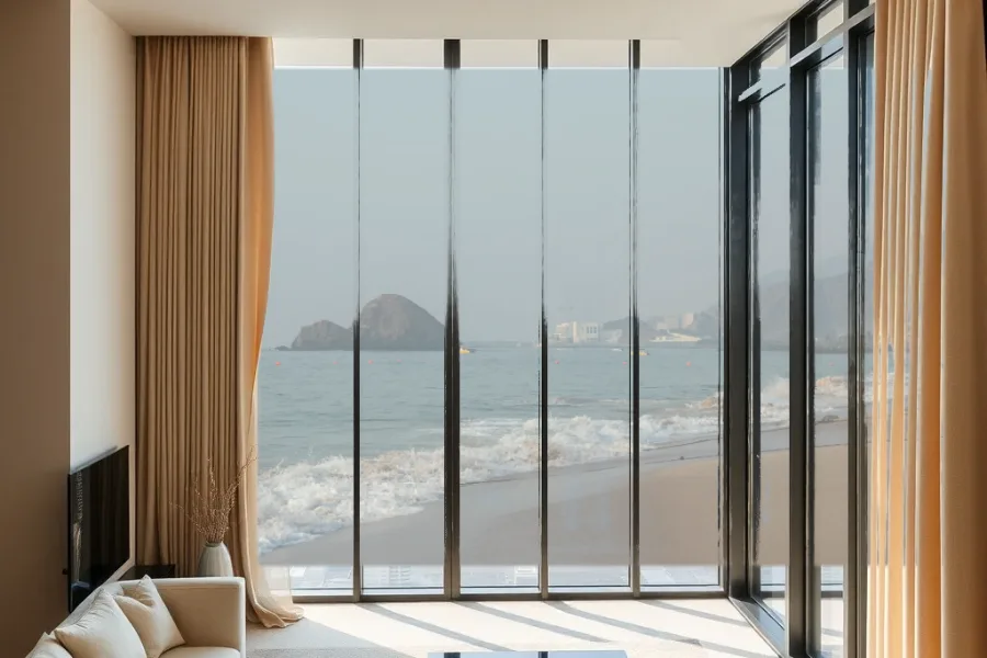 Illustrative view: a room with made-to-measure curtains and the Fujairah coast beyond the window