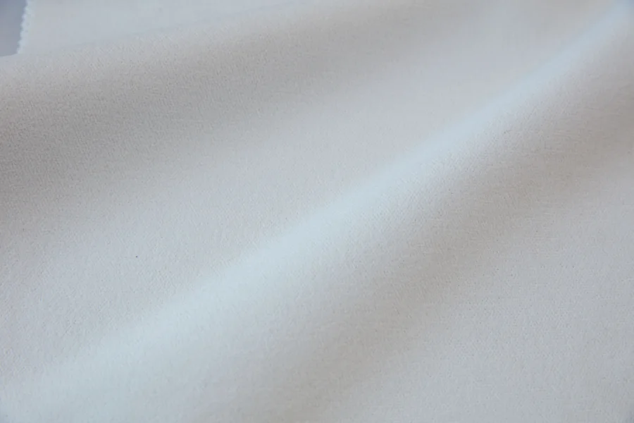 Catalogue 302 shade 302-01, Bright White — blackout curtain fabric close-up showing the weave and drape