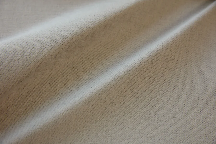 Catalogue 302 shade 302-09, Warm Stone Grey — blackout curtain fabric close-up showing the weave and drape