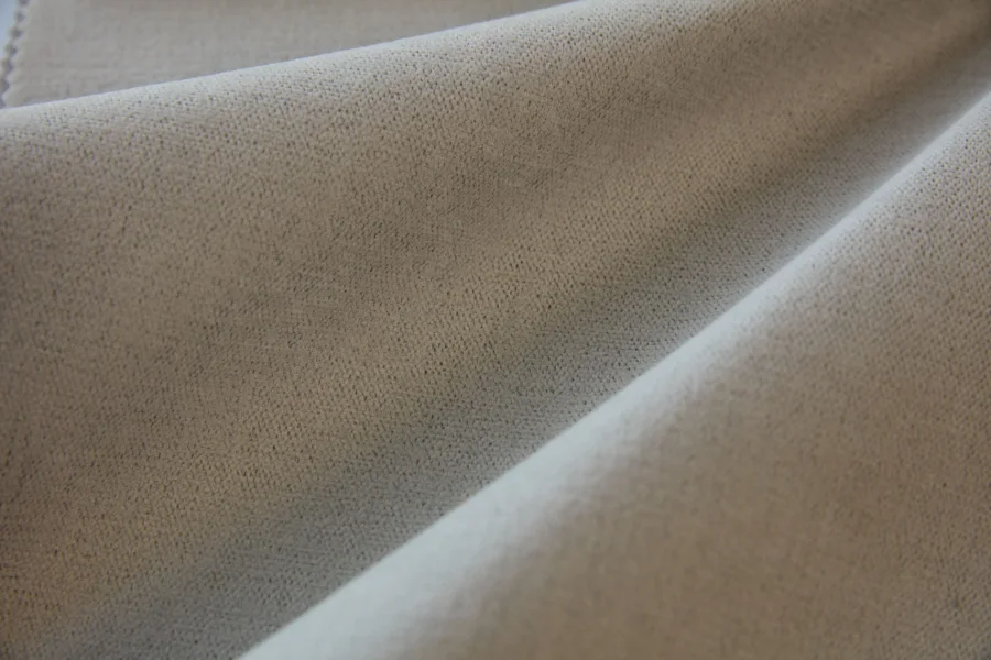 Catalogue 302 shade 302-10, Pale Oat Greige — blackout curtain fabric close-up showing the weave and drape