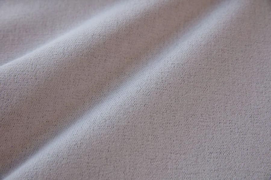 Catalogue 302 shade 302-14, Mauve Greige — blackout curtain fabric close-up showing the weave and drape
