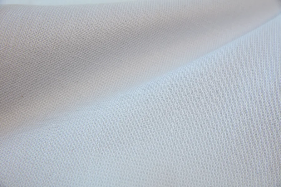 Catalogue 303 shade 303-02, White — blackout curtain fabric close-up showing the weave and drape