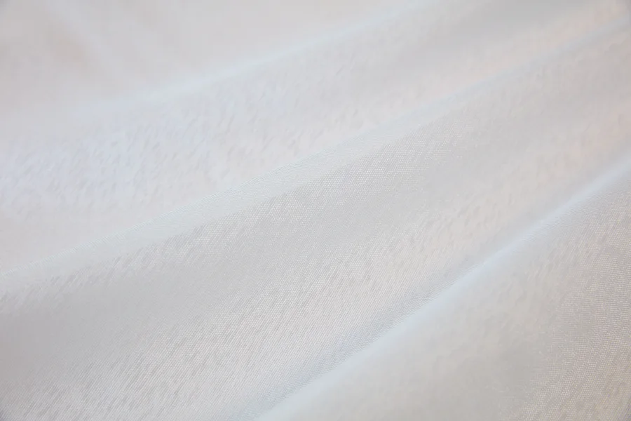 Catalogue 401 shade 401-07, White TTL Sable — chiffon sheer curtain fabric close-up showing the weave and drape
