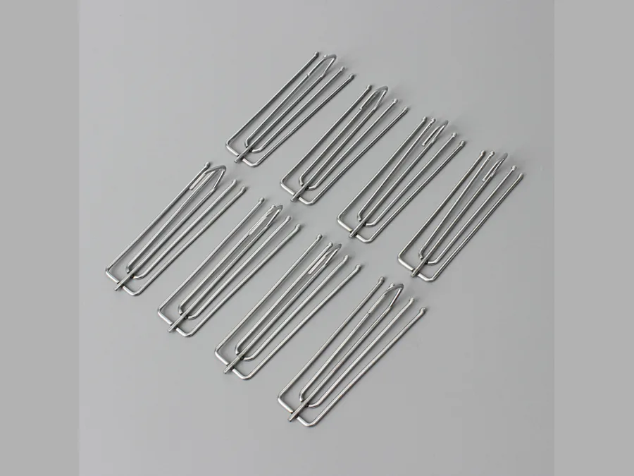 Group of metal pinch pleat curtain hooks