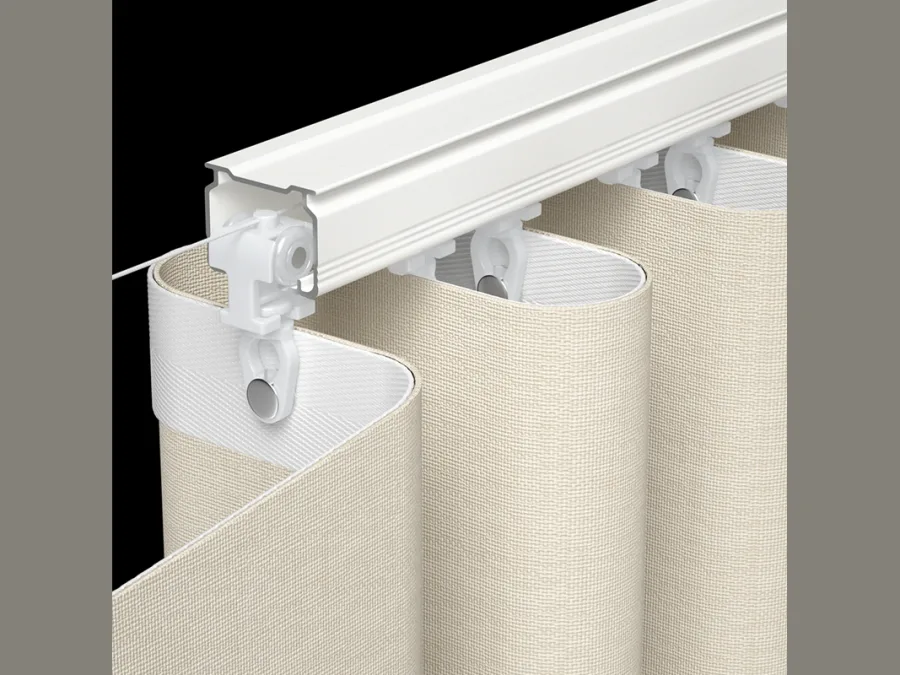 Wave curtain hanging from a white ceiling track on wave runners