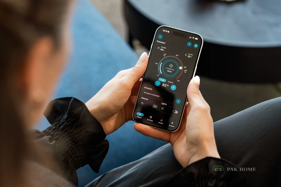 Person controlling a smart home system from a touchscreen app on a phone